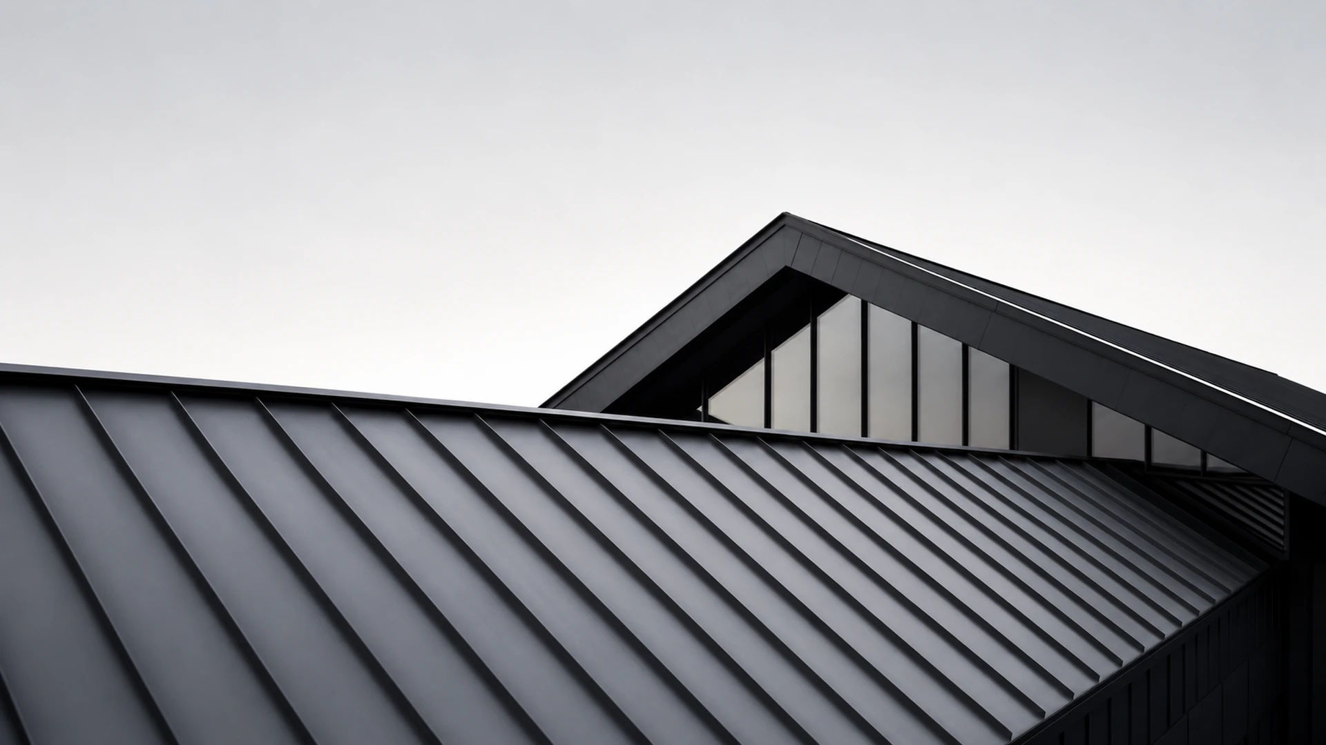 Modern house with dramatic dark metal roof